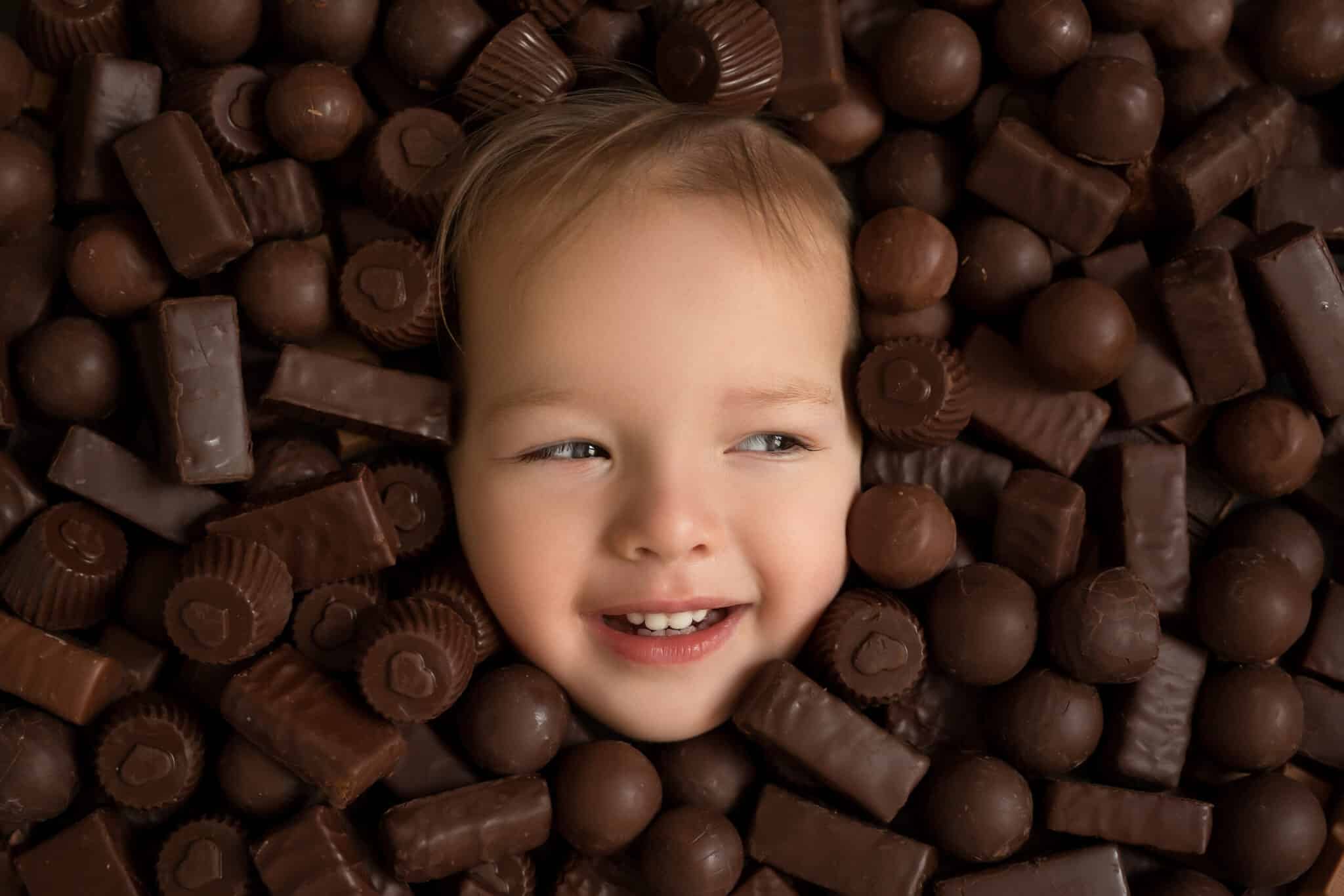 girl-s-face-on-a-background-of-chocolates-2024-11-28-22-20-52-utc girl-s-face-on-a-background-of-chocolates-2024-11-28-22-20-52-utc